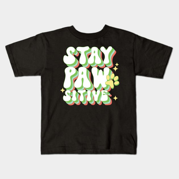 Retro Stay Pawsitive Dog Paw Kids T-Shirt by Teewyld